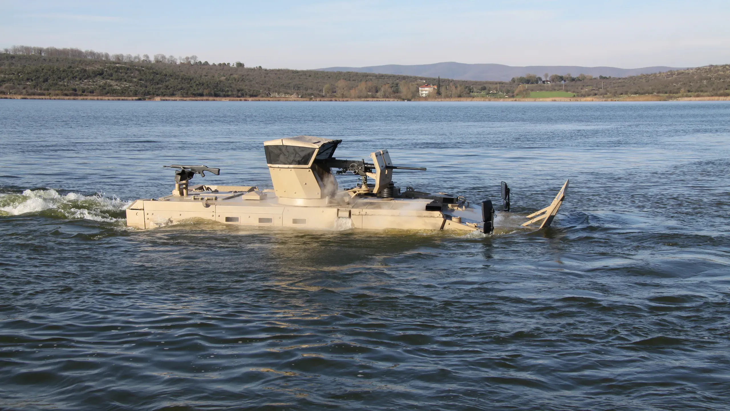 Amphibious TAIMAS 6×6 swimming on a lake